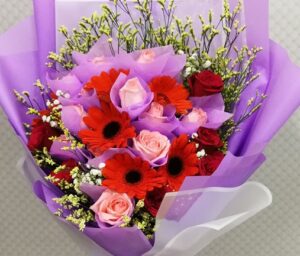 50 red roses with baby breath in a hand bouquet - Blooming