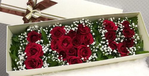 Red roses in a box with wording “I Love You"