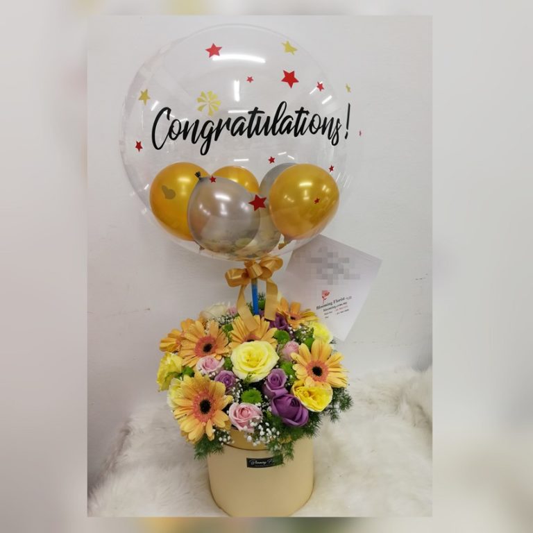 Mixed flowers in a box with hot air balloon Blooming