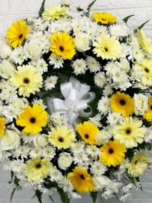 white lilies and white gerbera in a vase