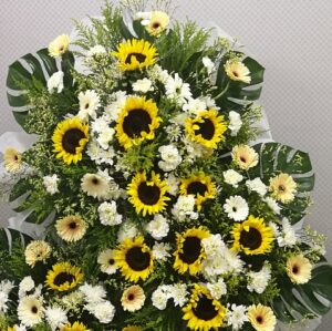 white lilies and white gerbera in a vase