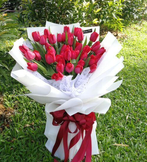 Red Tulips in a special hand bouquet