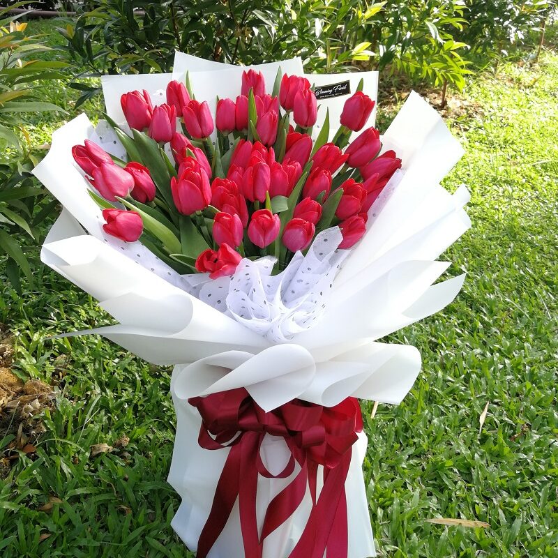 Red Tulips in a special hand bouquet