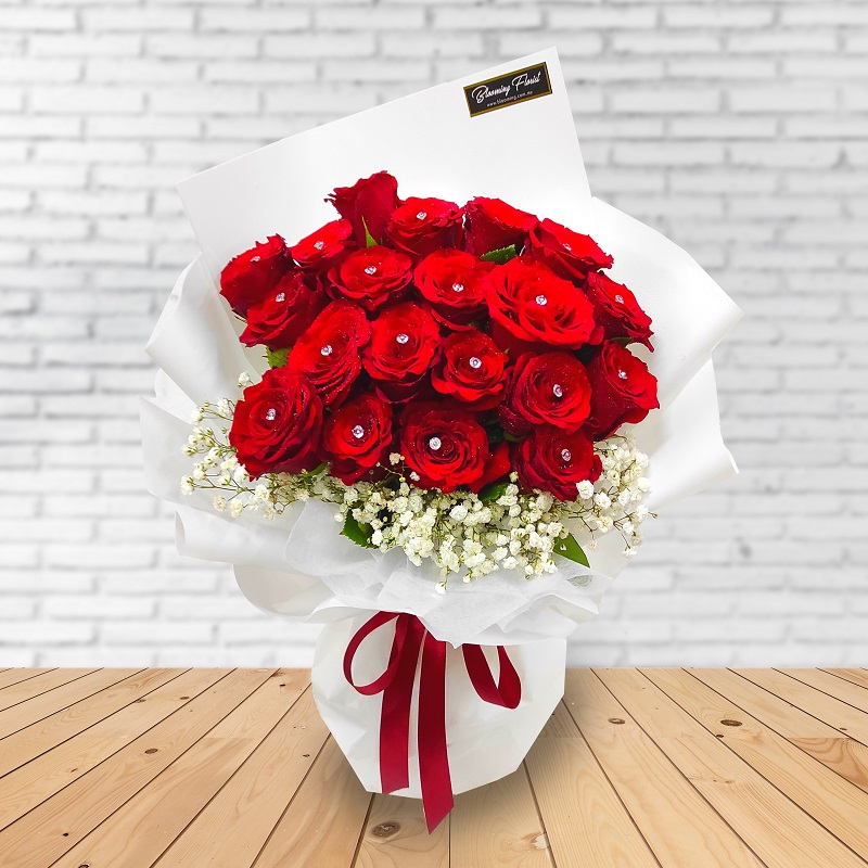 red roses bouquet in white